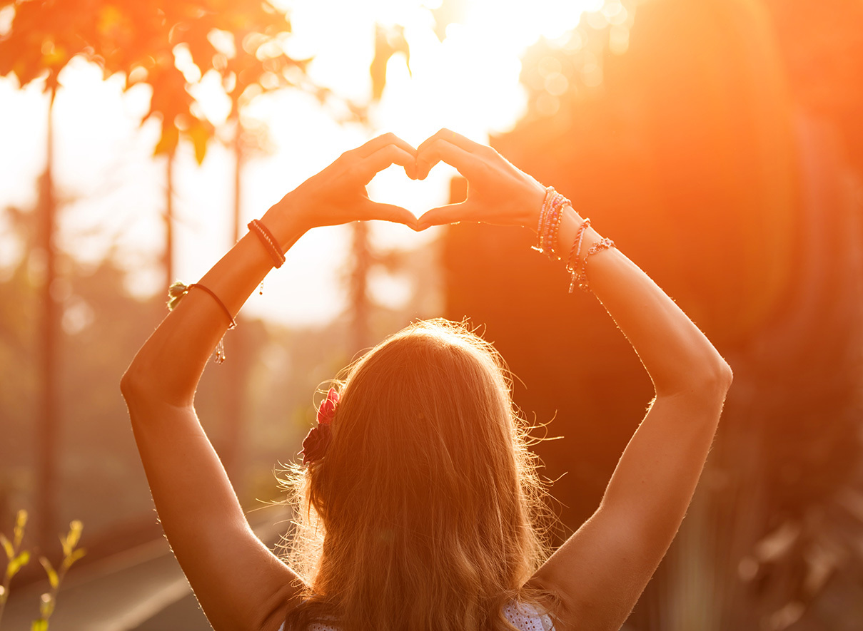 Woman  making a heart sign 